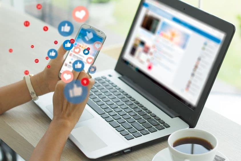 Businesswoman using smartphone for social media.