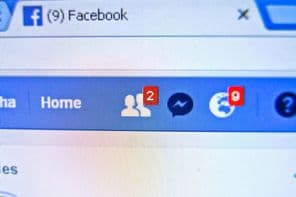 The Facebook website on the monitor.